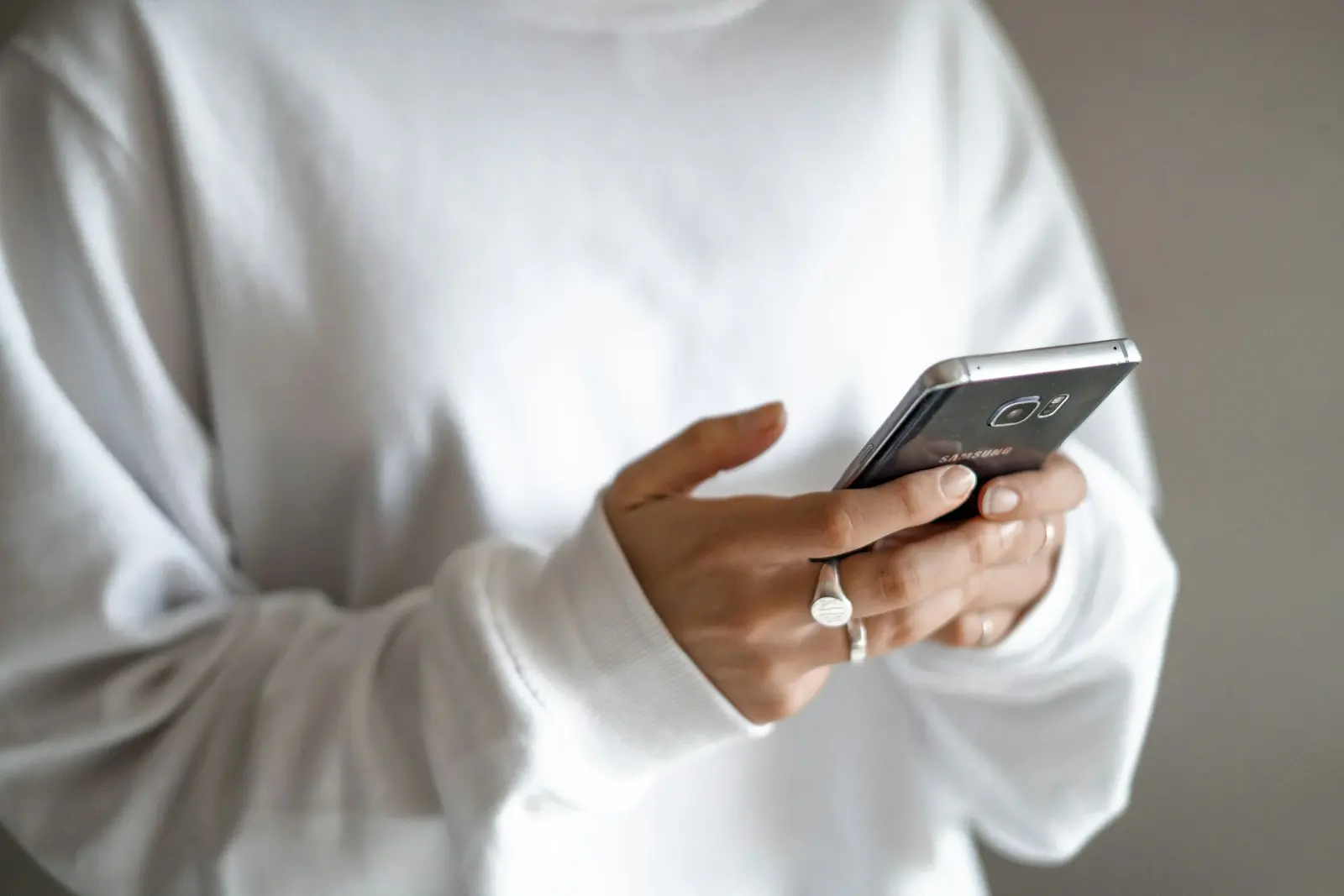 A guest reading on a phone