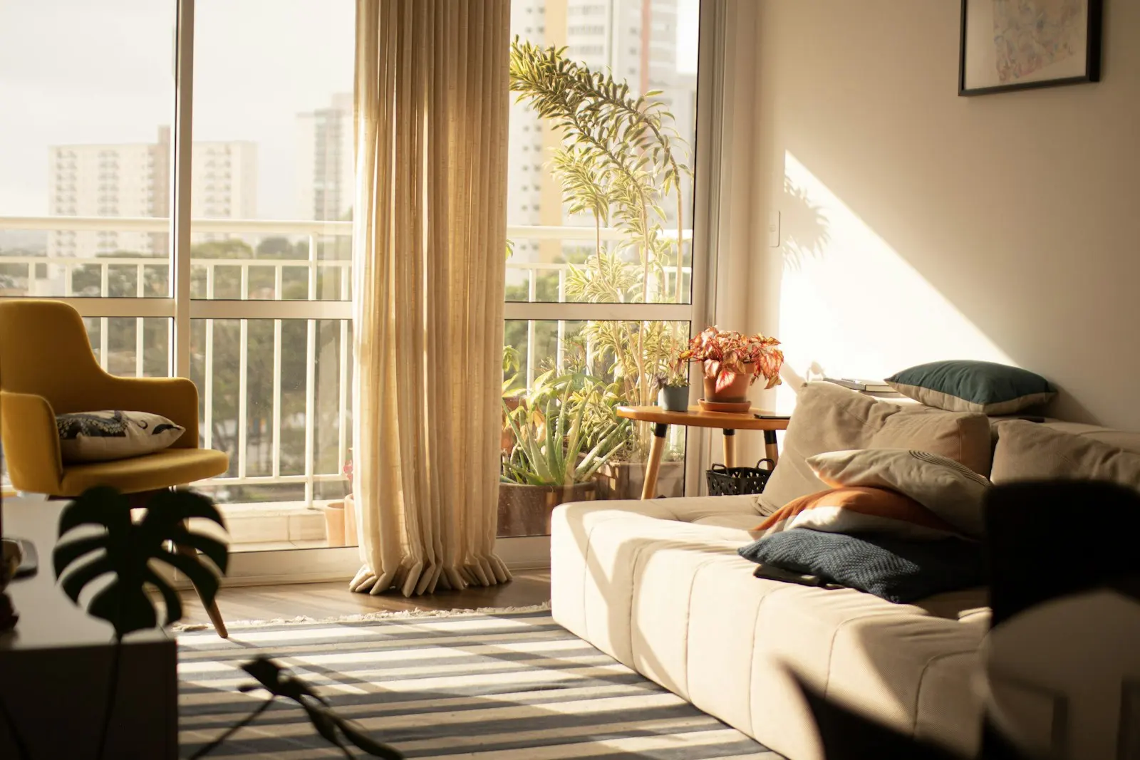 A sunlit living room in a short-term rental apartment