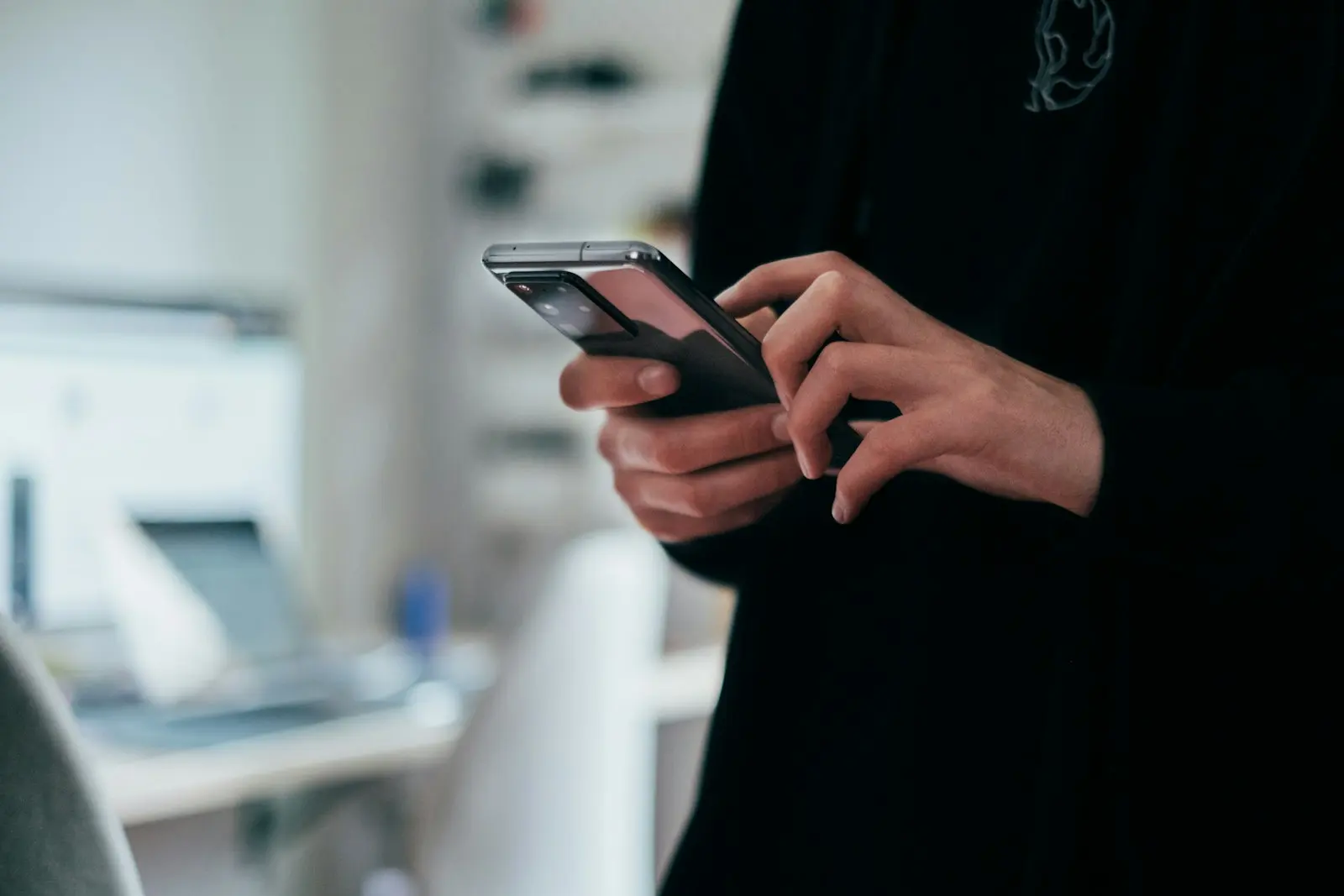 A manager checking a phone